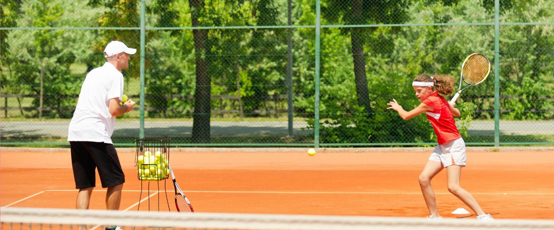 junior tennis coaching in action