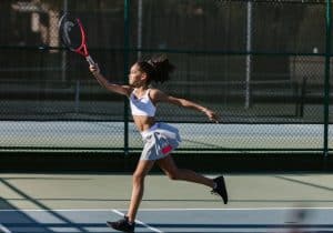 young girl in a beginners tennis class
